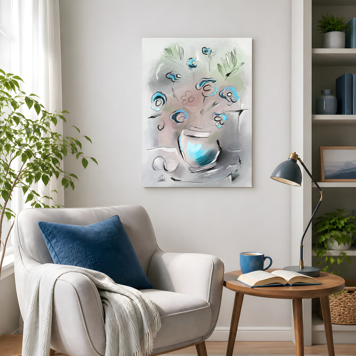 Abstract floral canvas wall art in blue, gray, and white tones, displayed in a styled living room setting above a light gray armchair with a blue pillow and a wooden side table.